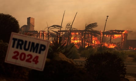 A mountain fire burns, with a Trump 2024 campaign poster visible