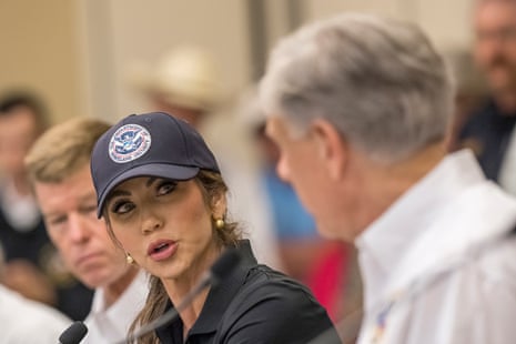 Kristi Noem speaks with Texas Gov Greg Abbott about ongoing search and rescue efforts at a press conference in Kerrville, Texas.