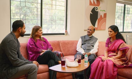Sima Taparia (second from left) discussing potential life partners for Akshay (far left) with his parents on Indian Matchmaking.