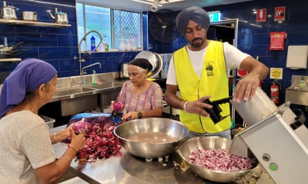 Sikh Volunteers Australia prepares meals for those hit by floods in Lismore at the Guru Nanak Sikh Temple in Woolgoolga