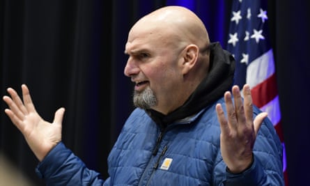 fetterman frowns and spreads his hands