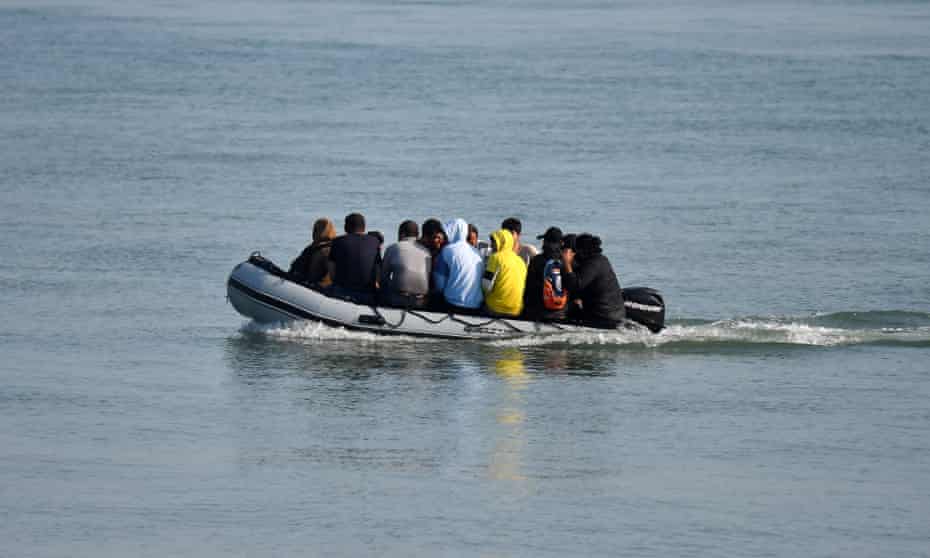 Asylum seekers arrive on the south coast in an inflatable boat in September 2020.