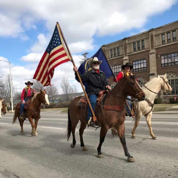 A procession of horse travelling through Lincoln, Nebraska, to celebrate the state’s 150th anniversary