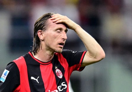 Milan’s Luka Modric looks dejected.
