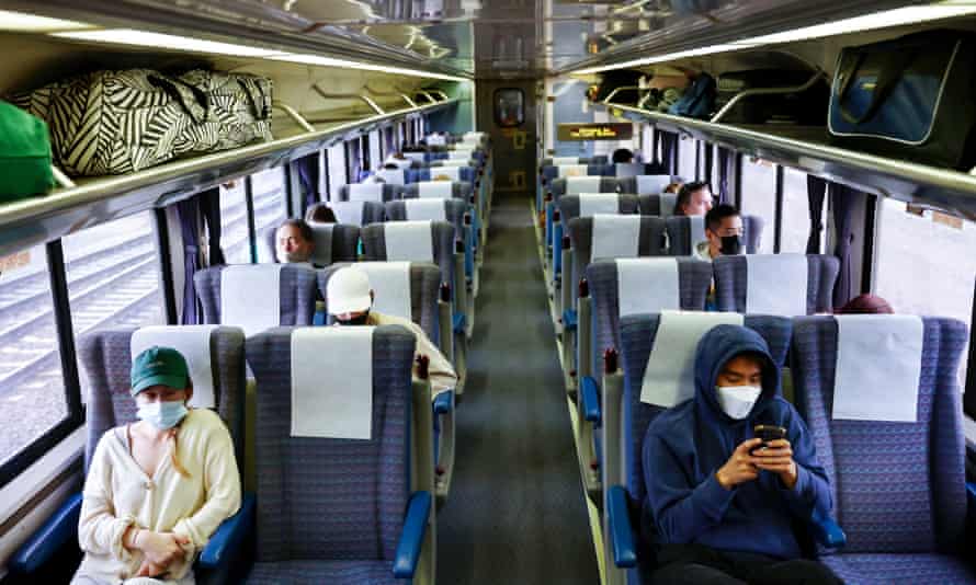 Passengers ride aboard an Amtrak train near Fullerton, California, in December 2021.