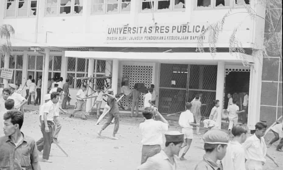 An anti-communist mob attacks the Res Publica University in Jakarta, Indonesia, 12 October 1965. The University was perceived to have communist ties.
