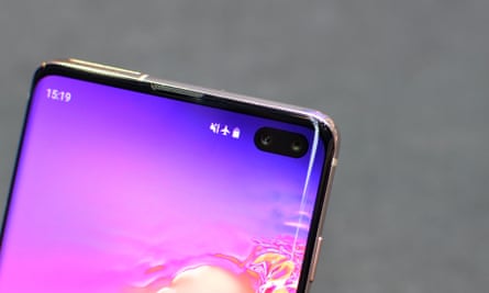 The two selfie cameras poke through a small oval-shaped cut out in the screen of the Galaxy S10+.