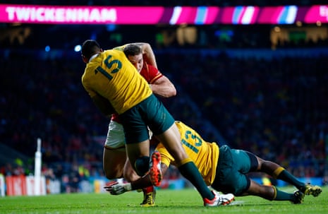 An example of Australia’s defensive fortitude as George North is stopped by Israel Folau and Tevita Kuridrani.