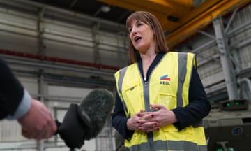 A street cleaner works outside 11 Downing Street, the official residence of chancellor of the exchequer Rachel Reeves.