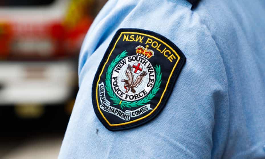 A NSW police logo on a police officer's shirt