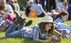 The Telegraph Hay Festival<br>HAY-ON-WYE, WALES - MAY 25:  A young girl enjoys reading a book in the sun at The Telegraph Hay festival at Dairy Meadows on May 25, 2013 in Hay-on-Wye, Wales.  (Photo by David Levenson/Getty Images)