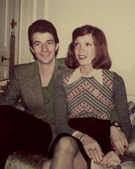 Paul Smith is shown in an old photograph sitting on a sofa with his wife, both smartly dressed.