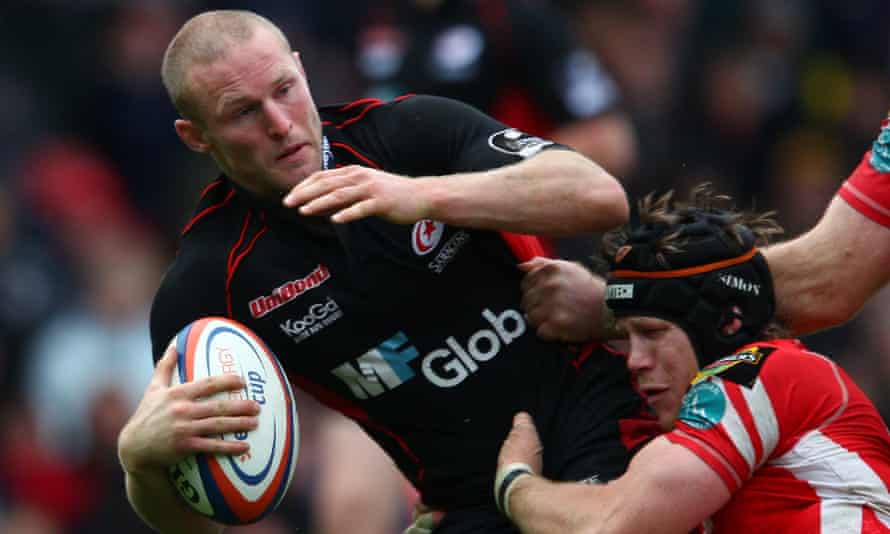 Dan Scarbrough being tackled while playing for Saracens against Llanelli Scarlets at Vicarage Road in October 2008