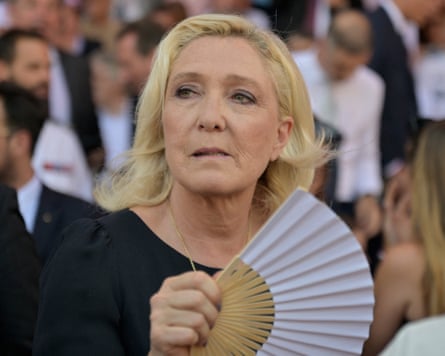 Marine Le Pen holding a fan