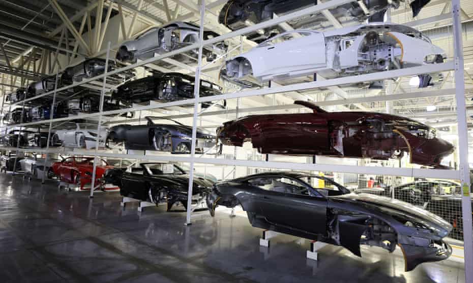 Car bodies are stored on shelves at the Aston Martin factory in Gaydon, Britain