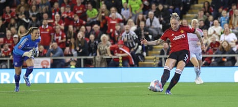 Leah Galton of Manchester United scores their equaliser in the Women’s Super League game against Arsenal.