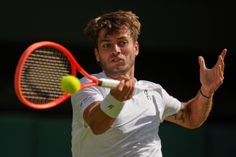 Flavio Cobolli hits a forehand return.