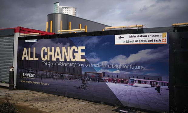 Hoardings outside Wolverhampton train station advertise Invest in Wolverhampton.