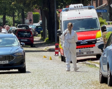 A member of emergency services works at the scene of what the police said was a deadly shooting in the town of Stade, Germany.