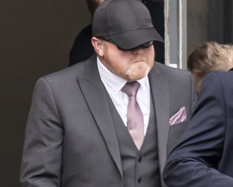 Robert Bush arriving at Hull magistrates court in 2025, wearing a suit, peaked cap and sunglasses