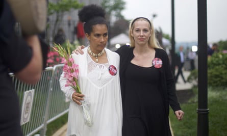 Accuser Lili Bernard (left) walks with Caroline Heldman outside the Montgomery County courthouse. They both wore large buttons which read ‘We stand in truth’.