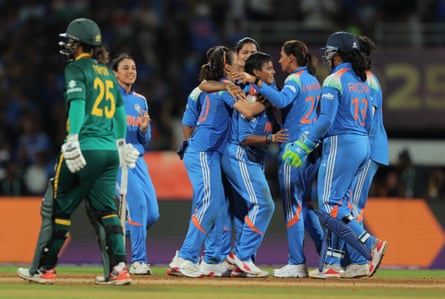 Deepti Sharma of India celebrates with team mates after taking the wicket of Chloe Tryon.
