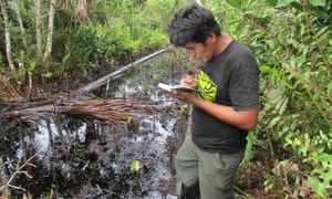 A Kukama environmental monitor, from indigenous organization ACODECOSPAT, inspects oil contamination in the Pacaya Samiria National Reserve in Peru’s Amazon.