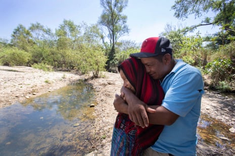 Francisco Sical hugs his daughter Melissa on the banks of the drying Salamá River in their Mayan village in Guatemala. They were subjected to the Trump administration’s Migrant Protection Protocols in May 2019 and spent two months in Juárez at the U.S.-Mexico border before returning home, defeated.