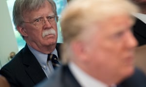 John Bolton listens as Donald Trump conducts a cabinet meeting at the White House.