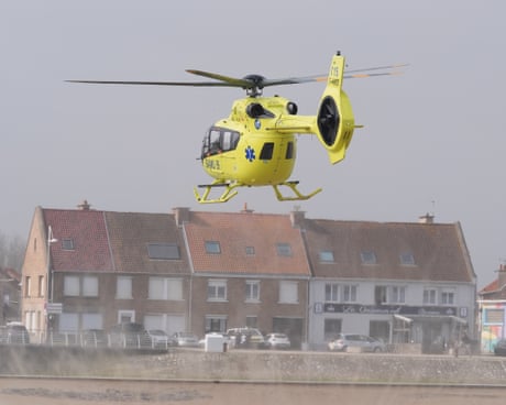 An emergency service helicopter at the beach in Gravelines, France, after people were pulled from the water. dqxikeidqkikdinv