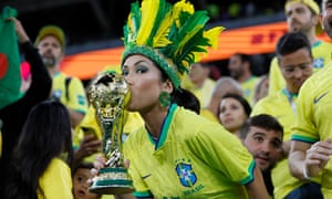 A Brazil fan with the trophy.