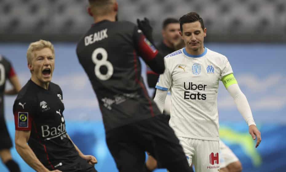 Florian Thauvin (right), who is out of contract this summer, reacts after missing a penalty against Nîmes.