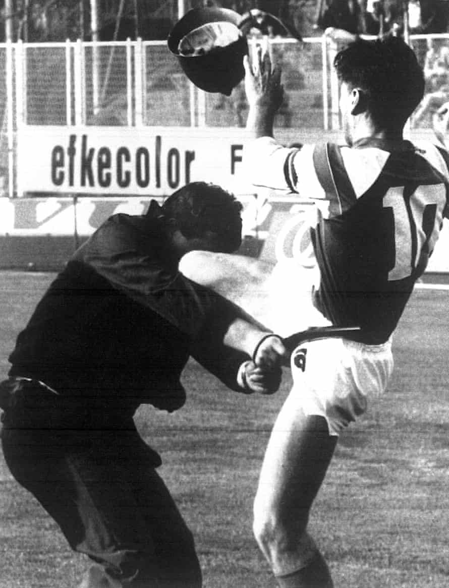 Dinamo Zagreb’s captain Zvonimir Boban kicks a police officer who had assaulted a Croatian fan as battle rages before their match against Red Star Belgrade was abandoned.