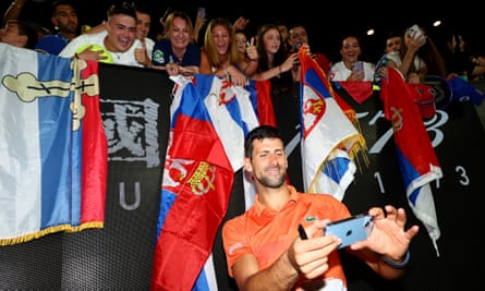 Novak Djokovic poses for a selfie with fans after a charity match against Nick Kyrgios in Melbourne