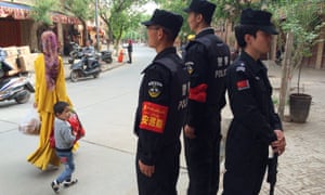 Police patrolling the Old Town in Kashgar.