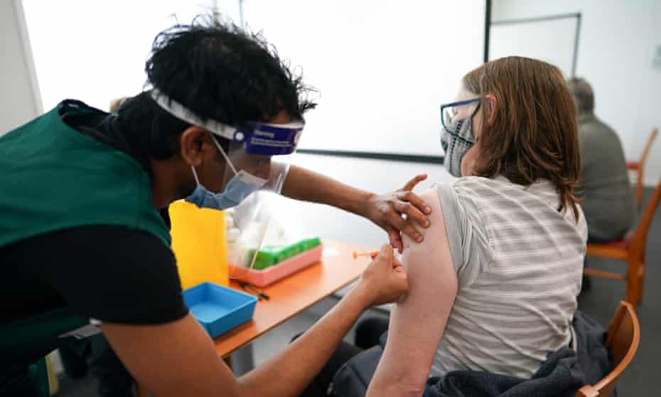 A person receives the Covid-19 vaccine
