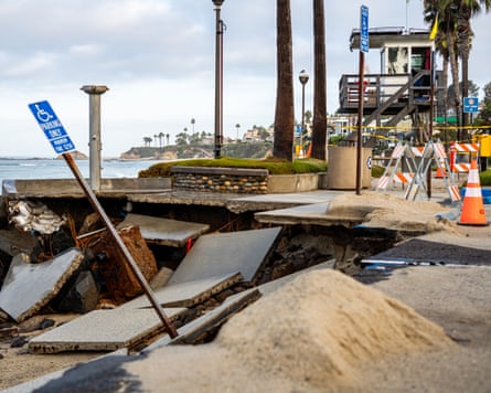 Part of the ground next to the beach has broken apart and fallen away on to the sand