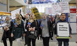 Demonstrators opposed to Donald Trump’s travel ban march at the Los Angeles international airport.