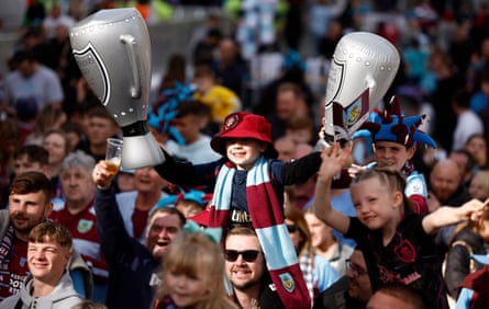 Burnley fans celebrate the club winning the Championship and promotion to the Premier League in May.