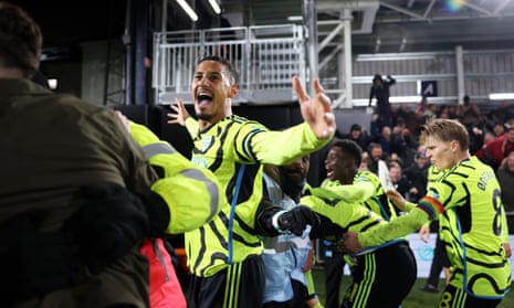 William Saliba celebrates after Arsenal’s stoppage-time win over Luton.