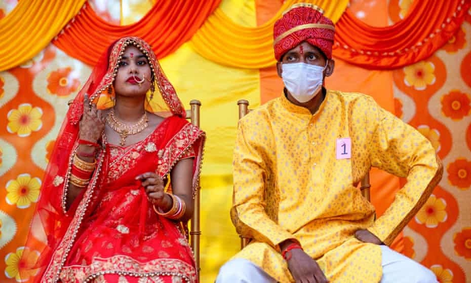 A couple await their marriage ceremony before India’s Omicron surge that has put paid to mass attendance on the big day. 