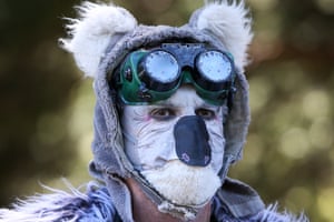 A climate activist dresses as a koala during a COP26 Climate Change protest in Sydney on Saturday