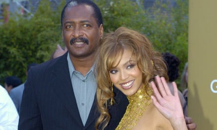 Beyonce Knowles arrives at the 46th annual Grammy Awards with her father on 8 February 2004.