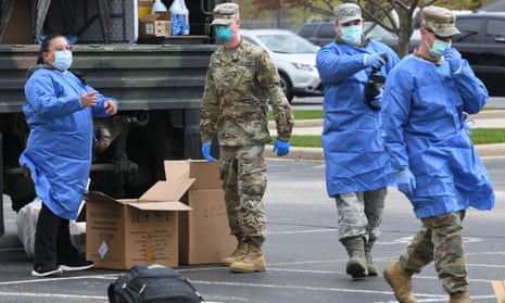 Members of the Wisconsin national guard conduct drive through testing for the coronavirus at Burlington high school.