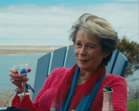 She told a wine glass and sits in an adirondack chair