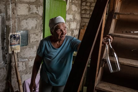 Vira inside what remains of her house.