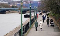 Pedestrians walk beside the River Trent in West Bridgeford, Nottingham, during England’s third national lockdown.