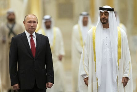 Vladimir Putin, left, walks with Crown Prince Mohamed bin Zayed Al Nahyan during an official welcome ceremony in Abu Dhabi, UAE, in 2019.
