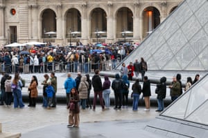 People queue outside the Louvre