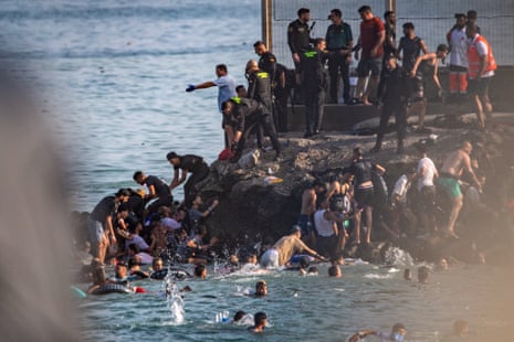 Migrants tried to cross from Morocco into the Spanish enclave of Ceuta on Thursday.